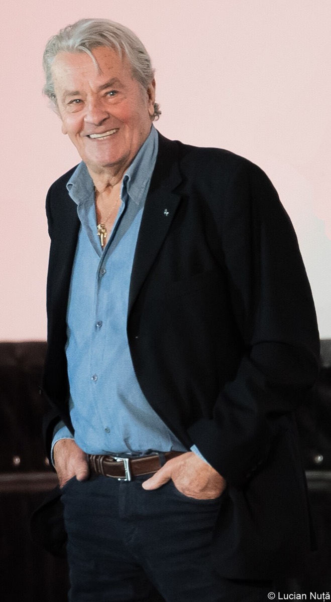 Alain Delon: Black jacket, denim shirt and jeans
