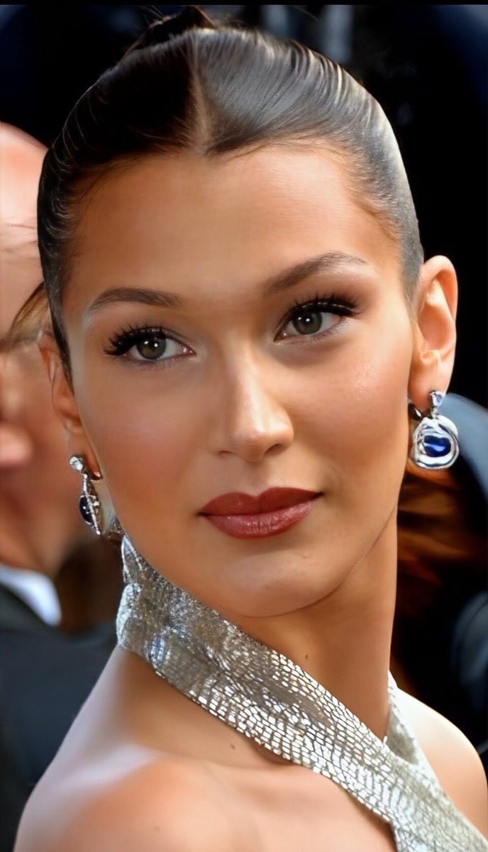 Bella Hadid: Silver halter and sapphire earrings