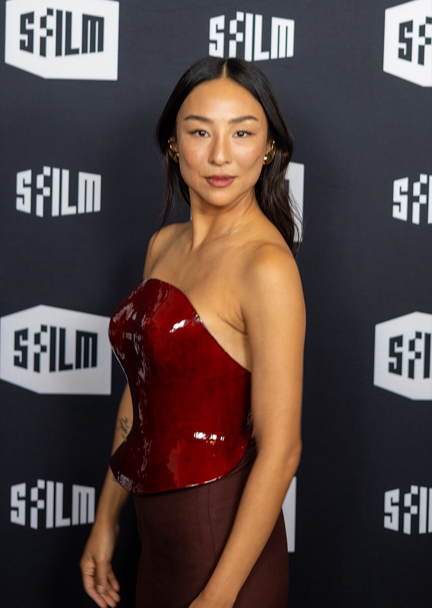 Greta Lee: Red leather corset dress