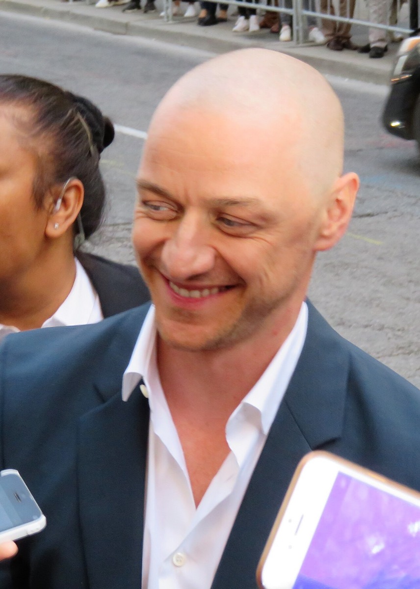 James McAvoy: Navy jacket and open white shirt