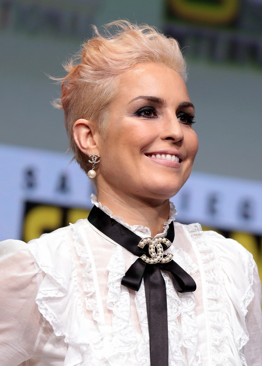 Noomi Rapace: White lace blouse and black bow
