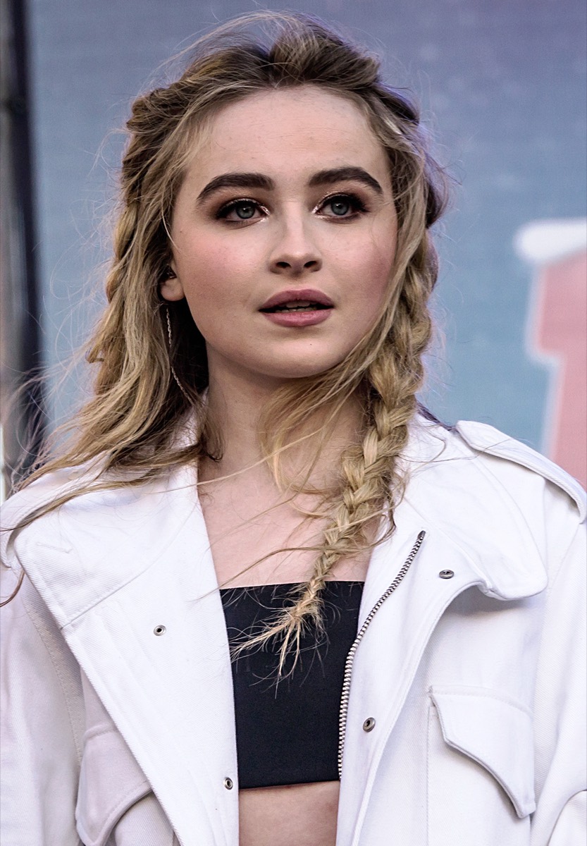 Sabrina Carpenter: White utility jacket and crop top