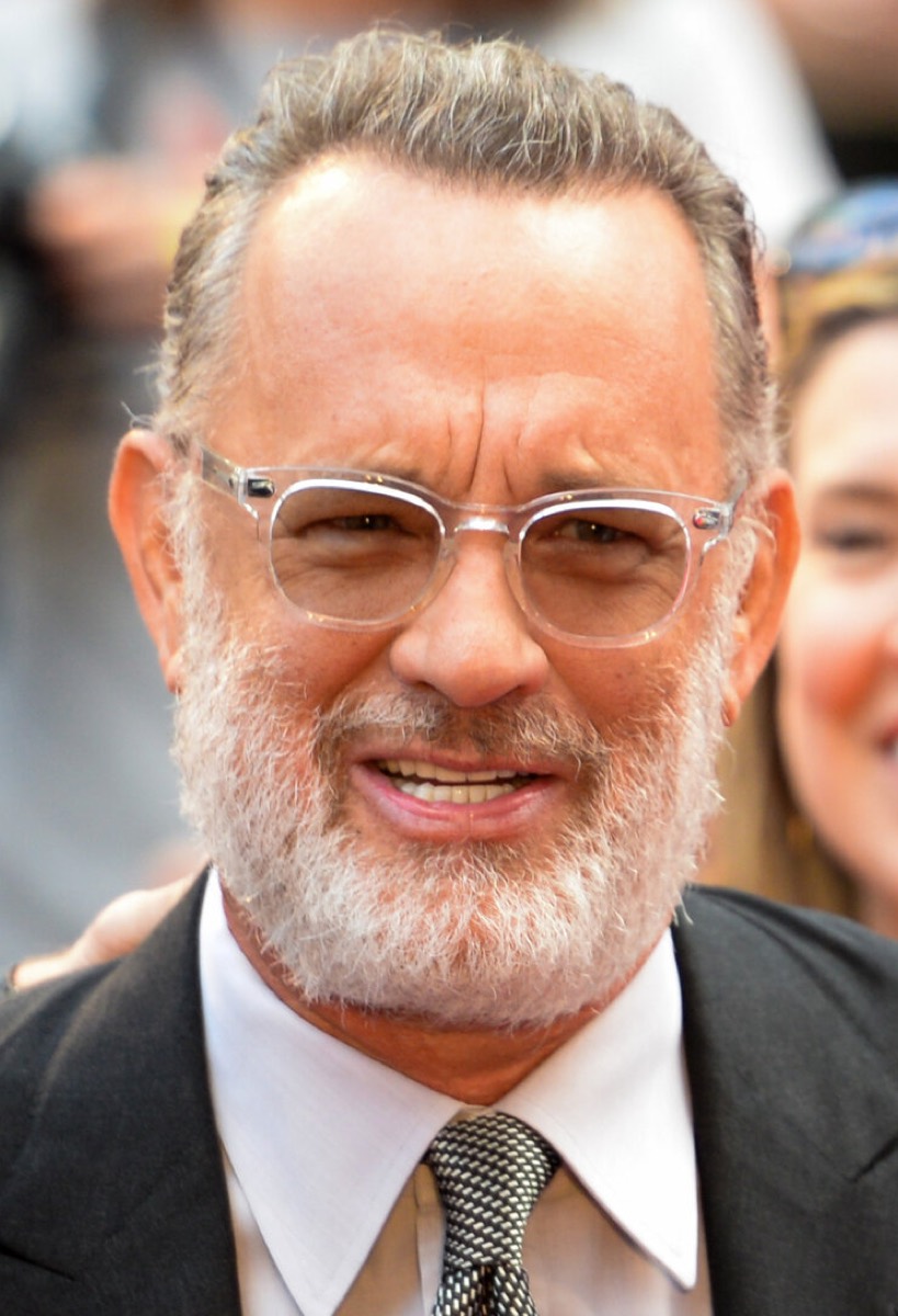 Tom Hanks: Clear glasses and silver tie