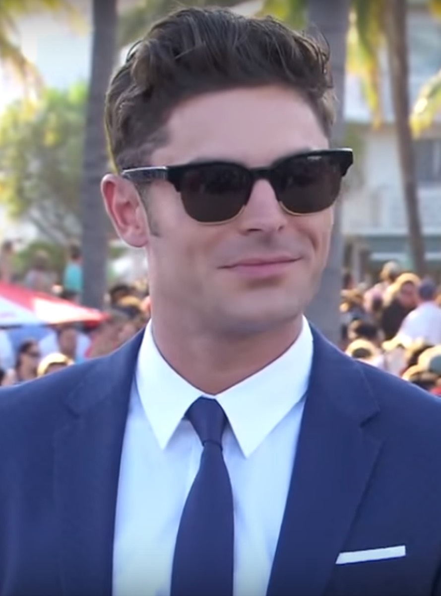 Zac Efron: Navy suit and black sunglasses